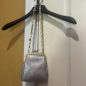 Gorgeous small purse with a beautiful chain in soft gold tone.